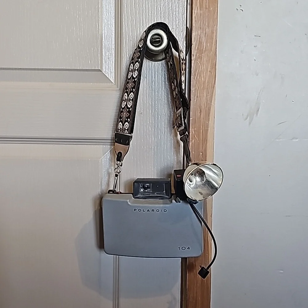 Vintage Polaroid automatic 104 land camera with beautiful strap